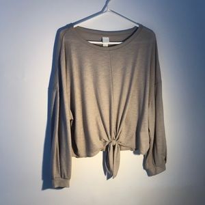 Cool-toned beige. Long sleeve light weight shirt. Ties in the front.